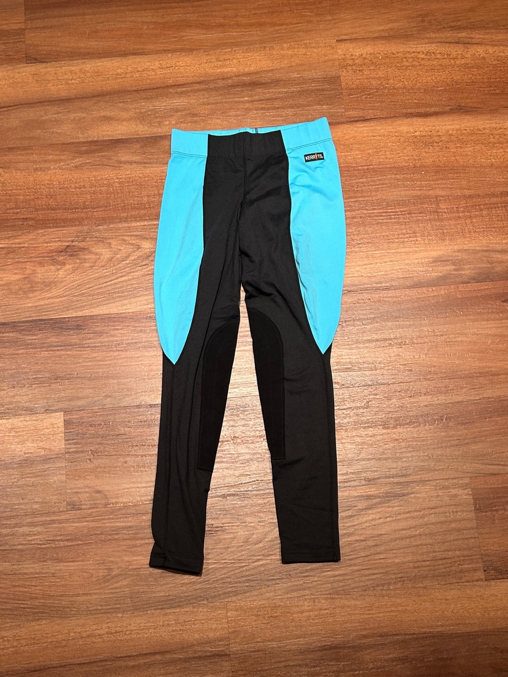 Women’s Kerrits Black and Aqua Jodhpurs for Horseback riding.